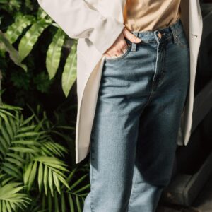 Stylish outfit combining denim jeans and a blazer, ideal for casual or professional settings.